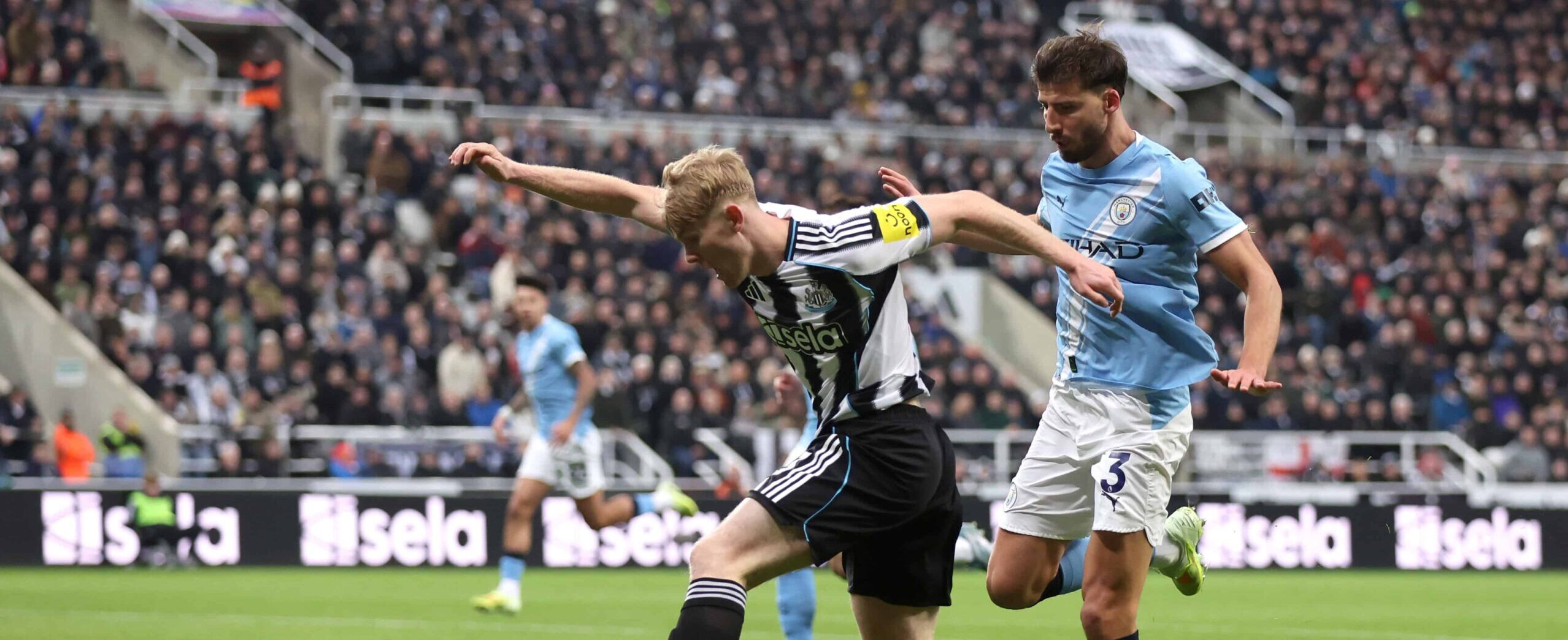 Lewis Hall in action against Manchester City in 2025 - crossing the ball