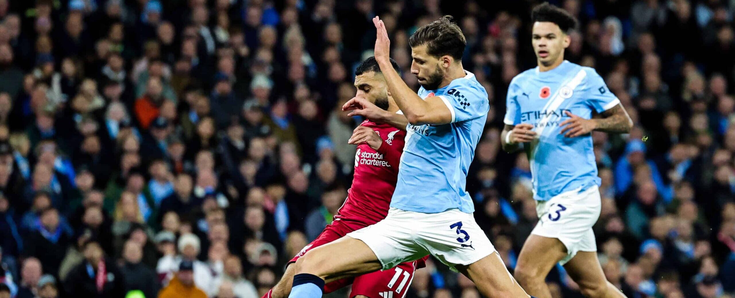 Ruben Dias in action for Manchester City in 2025 against Salah Liverpool