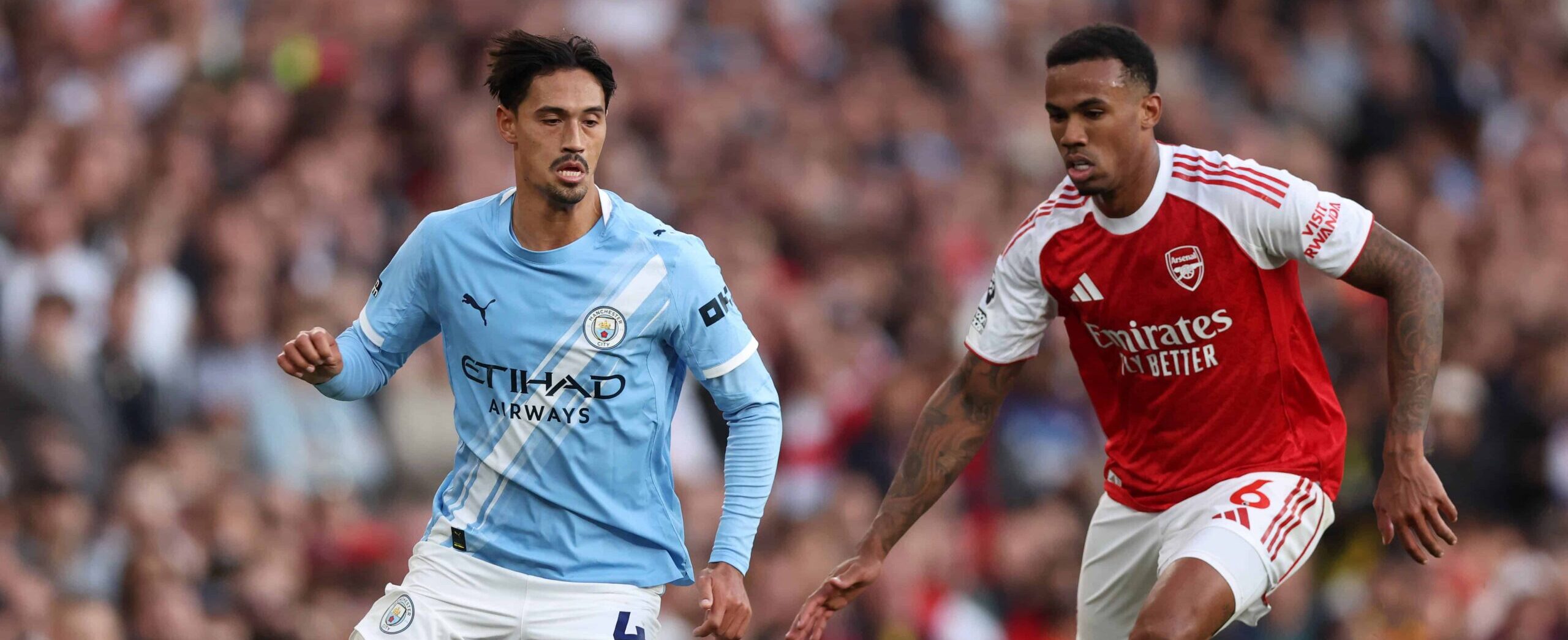 Reijnders in action for Manchester City against Arsenal in 2025